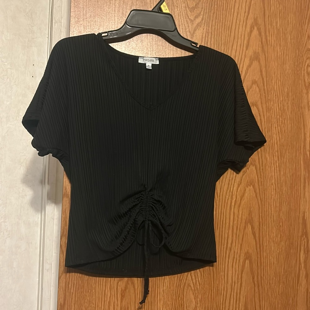 Cute Black Top with tie at bottom of front of shirt.